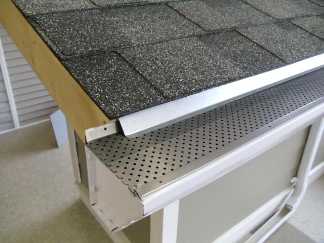 The Gutter Guy - Gutter guards installed on black roof